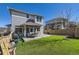 Backyard with well-maintained turf, deck, and privacy fence for outdoor enjoyment at 3744 Celestial Ave, Castle Rock, CO 80109