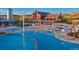 Inviting community pool area featuring clear blue water and comfortable lounge chairs for relaxing at 3744 Celestial Ave, Castle Rock, CO 80109