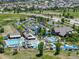 Aerial view of the community pool and recreation center surrounded by lush greenery and residential homes at 3744 Celestial Ave, Castle Rock, CO 80109