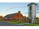 Exterior of the community building with a rustic design, complemented by a modern silo at 3744 Celestial Ave, Castle Rock, CO 80109