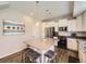 Bright kitchen with a center island, stainless steel appliances, and hardwood flooring at 3744 Celestial Ave, Castle Rock, CO 80109