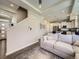 Bright living room showcasing modern decor, stairs, and an open-concept layout with a kitchen at 3744 Celestial Ave, Castle Rock, CO 80109