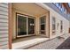 Covered back patio with sliding glass doors that let in lots of light at 10557 Eby Cir, Lone Tree, CO 80124