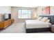 Inviting bedroom featuring a plush bed, modern dresser, and abundant natural light at 10557 Eby Cir, Lone Tree, CO 80124