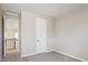 Neutral bedroom with gray carpet, white door, and natural light at 10557 Eby Cir, Lone Tree, CO 80124