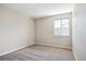 Bright bedroom with a window and neutral carpet at 10557 Eby Cir, Lone Tree, CO 80124