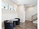Dining area featuring a small round table and chairs adjacent to a staircase at 10557 Eby Cir, Lone Tree, CO 80124