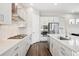 Modern kitchen featuring white cabinets, stainless steel appliances, and a gas cooktop at 10557 Eby Cir, Lone Tree, CO 80124