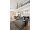 Bright living room with a modern kitchen, sleek countertops, and open layout at 10557 Eby Cir, Lone Tree, CO 80124
