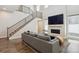 Living area showcasing a fireplace, open floor plan, and staircase leading to the upper level at 10557 Eby Cir, Lone Tree, CO 80124