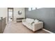 Relaxing living room with neutral colors and a gray accent wall at 10557 Eby Cir, Lone Tree, CO 80124