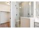 Clean glass shower with grey tiling in the bathroom at 10557 Eby Cir, Lone Tree, CO 80124