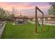 Expansive backyard featuring a covered patio area with outdoor seating and a relaxing hammock at 11896 W 107Th Ave, Westminster, CO 80021