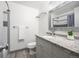 Bathroom with updated vanity with granite countertops and updated fixtures and lighting at 11896 W 107Th Ave, Westminster, CO 80021