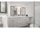 Bright bathroom featuring dual sinks with modern framed mirrors and great lighting at 11896 W 107Th Ave, Westminster, CO 80021