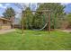 Backyard with hammock in frame surrounded by large trees at 11896 W 107Th Ave, Westminster, CO 80021