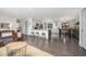 Open concept kitchen with a breakfast bar, stainless steel appliances, and dining area nearby at 11896 W 107Th Ave, Westminster, CO 80021