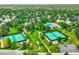 Community featuring tennis courts, a swimming pool, green spaces, and walking paths amid mature trees at 5988 E Jamison Ln, Centennial, CO 80112