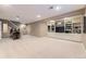 Finished basement with built-in shelving, carpeted floors, and ample space for entertainment at 5988 E Jamison Ln, Centennial, CO 80112