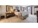Serene bedroom with a comfortable bed, bedside table, and decorative artwork at 5988 E Jamison Ln, Centennial, CO 80112