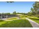 Beautiful park with a picnic table, benches, tennis court, and walking path to enjoy the outdoors at 5988 E Jamison Ln, Centennial, CO 80112