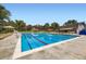Large, inviting community pool with lounge chairs and umbrellas, perfect for summer relaxation and recreation at 5988 E Jamison Ln, Centennial, CO 80112