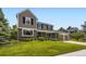 Traditional two-story home with manicured lawn, brick, and a two-car garage at 5988 E Jamison Ln, Centennial, CO 80112