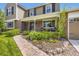 Inviting front porch features brick walkway, decorative landscaping, and seating area at 5988 E Jamison Ln, Centennial, CO 80112
