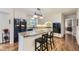 Bright kitchen with an island, granite countertops, and stainless steel appliances at 5988 E Jamison Ln, Centennial, CO 80112