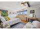 Bedroom with a pitched roof, ceiling fan and brightly lit by natural light at 3895 Chimayo Rd, Littleton, CO 80123
