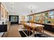 Stylish dining area with large windows, sleek lighting, and a mid-century modern aesthetic design and decor at 3895 Chimayo Rd, Littleton, CO 80123