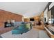 Spacious living room with a cozy fireplace, elegant decor, and ample natural light at 3895 Chimayo Rd, Littleton, CO 80123