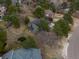 Aerial view of a property featuring mature trees, fenced backyard, and inviting landscaping at 8165 Tempest Ridge Way, Parker, CO 80134
