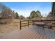 Back deck offers outdoor seating with a table and chairs, overlooking a spacious yard at 8165 Tempest Ridge Way, Parker, CO 80134