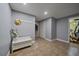 Finished basement area with neutral tones, ceramic tile flooring, and ample storage space at 8165 Tempest Ridge Way, Parker, CO 80134