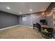 Finished basement features neutral carpet, a desk area, and recessed lighting at 8165 Tempest Ridge Way, Parker, CO 80134