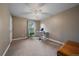 Bedroom features a ceiling fan, window, and tan colored carpet at 8165 Tempest Ridge Way, Parker, CO 80134