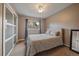 Bright bedroom features a window, closet, and neutral decor at 8165 Tempest Ridge Way, Parker, CO 80134