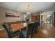 Spacious dining area with hardwood floors, stylish lighting, and adjacent staircase at 8165 Tempest Ridge Way, Parker, CO 80134
