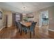 Elegant dining room with hardwood floors, stylish lighting, and a view into the kitchen at 8165 Tempest Ridge Way, Parker, CO 80134