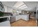 Bright kitchen featuring stainless appliances, backsplash, and hardwood floors at 8165 Tempest Ridge Way, Parker, CO 80134