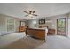 Spacious main bedroom with ensuite access and natural light from two windows at 8165 Tempest Ridge Way, Parker, CO 80134