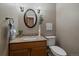 Cozy powder room with granite countertop, vessel sink, and decorative accents at 8165 Tempest Ridge Way, Parker, CO 80134