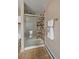 Bathroom shower with sliding door and tile surround at 8165 Tempest Ridge Way, Parker, CO 80134