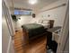 Serene bedroom features hardwood floors, cozy bedding and ambient light at 1024 E 14Th Ave # 2, Denver, CO 80218