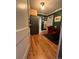 Open dining area featuring hardwood floors and a view into the galley kitchen at 1024 E 14Th Ave # 2, Denver, CO 80218