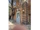 Charming brick building entrance featuring a classic address plaque and exterior lighting at 1024 E 14Th Ave # 2, Denver, CO 80218