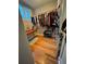 Spacious walk-in closet featuring hardwood floor, modern shelves and storage space at 1024 E 14Th Ave # 2, Denver, CO 80218