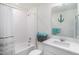 Bathroom featuring a shower-tub combo with curtain, a toilet, and vanity at 8852 Farmdale St, Firestone, CO 80504