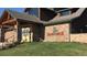 Clubhouse entrance with stone facade and Saddleback Golf Club sign at 8852 Farmdale St, Firestone, CO 80504